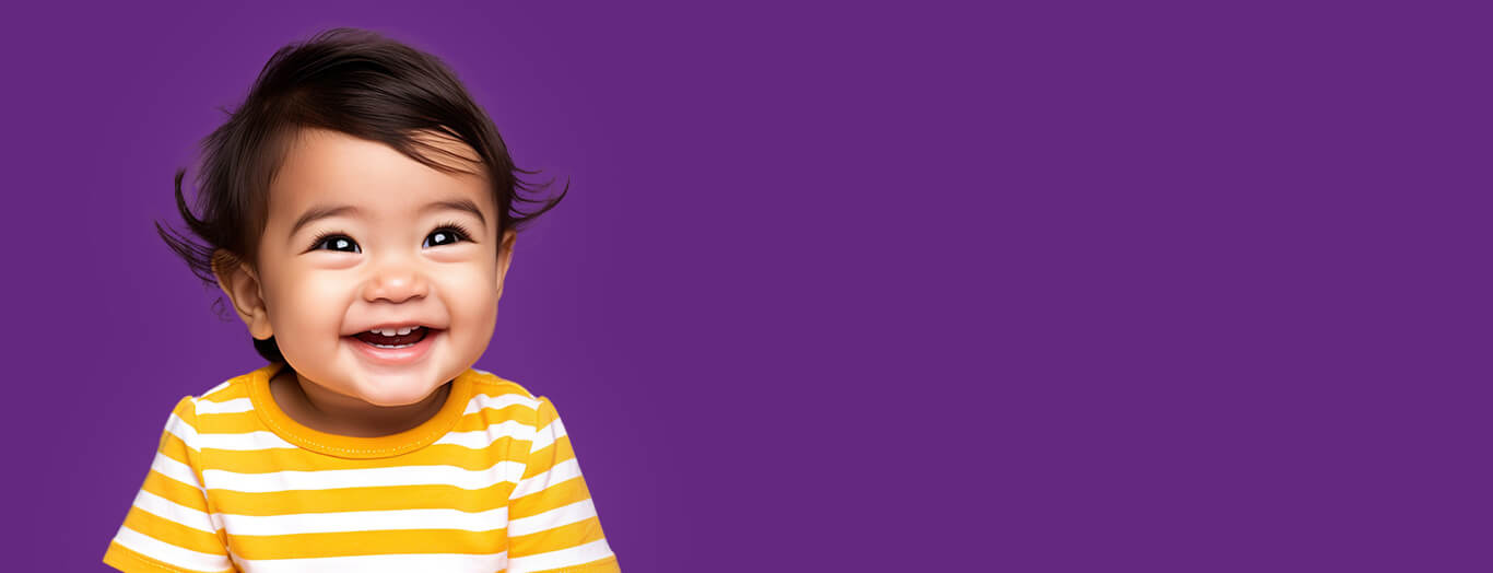 Photo of a cute, bright-eyed baby smiling